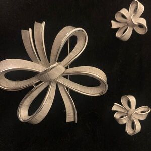 Stamped Trifari brooch and earring set.